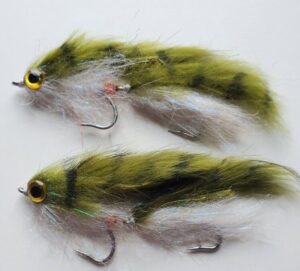 gray and white articulated streamer fly